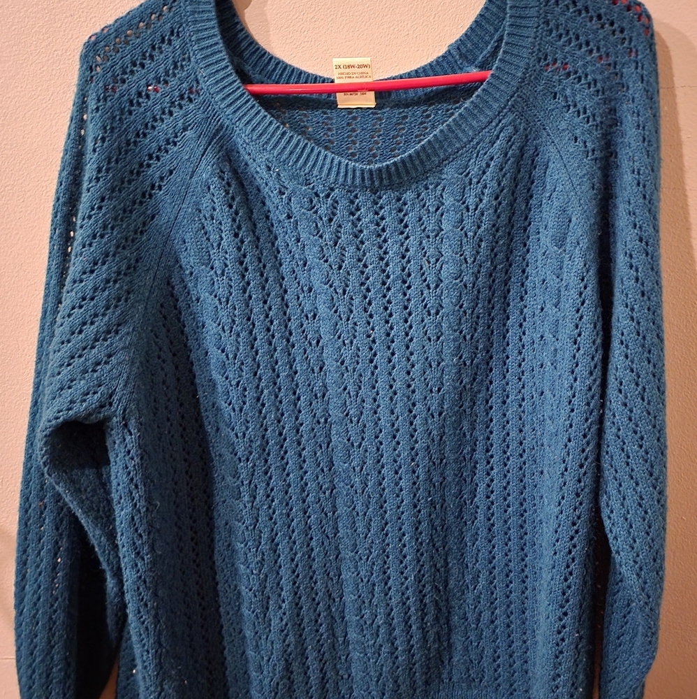 Dark teal colored sweater